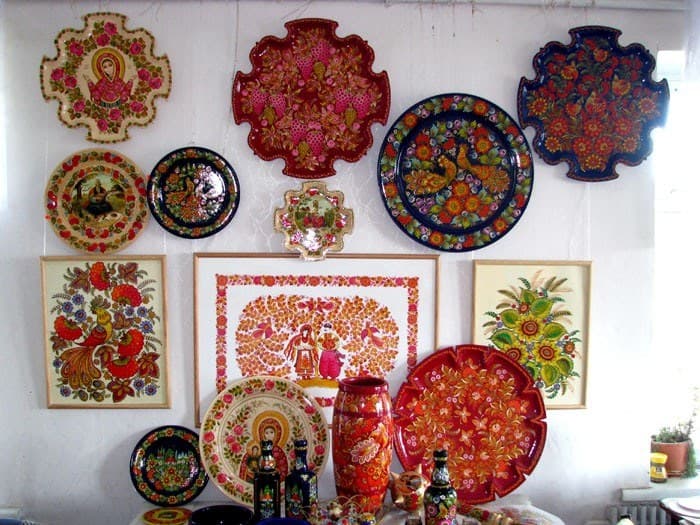 Painted plates and panels hung together at the Centre of Folk Art «Petrykivka»