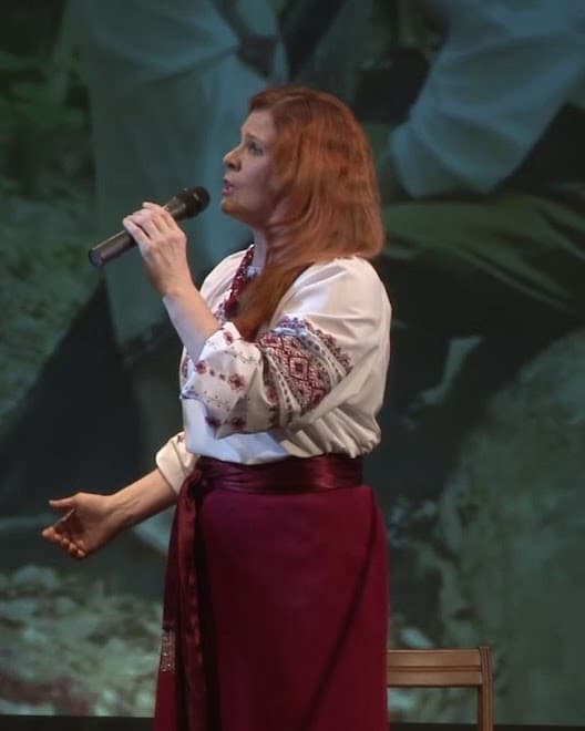 Oksana Pikush singing in an embroidered blouse